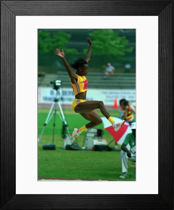 Framed Print : Jackie Joyner-Kersee Sailing Through the Air Framed Print : Jackie Joyner-Kersee Sailing Through the Air