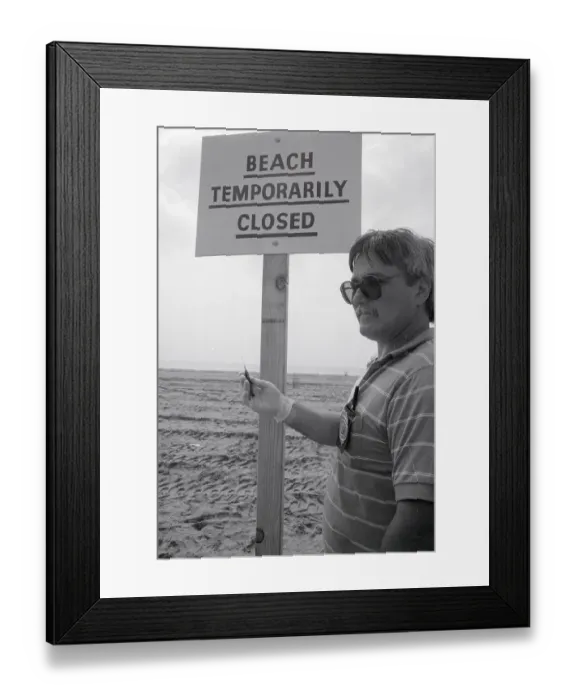 Framed Print : Inspector Finding Syringe on Beach Framed Print : Inspector Finding Syringe on Beach