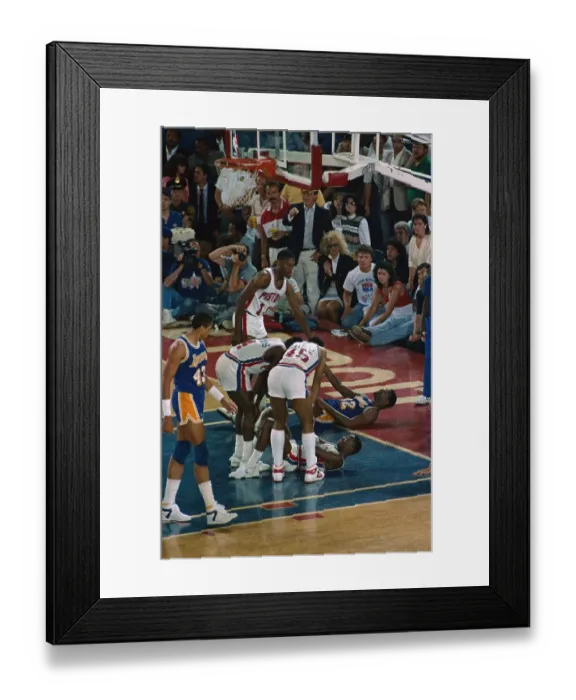 Framed Print : Isiah Thomas and Magic Johnson Being Helped up off the Floor Framed Print : Isiah Thomas and Magic Johnson Being Helped up off the Floor