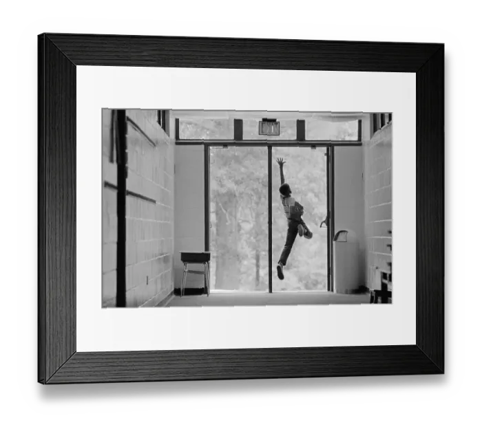 Framed Print : Boy Jumping in Doorway Framed Print : Boy Jumping in Doorway