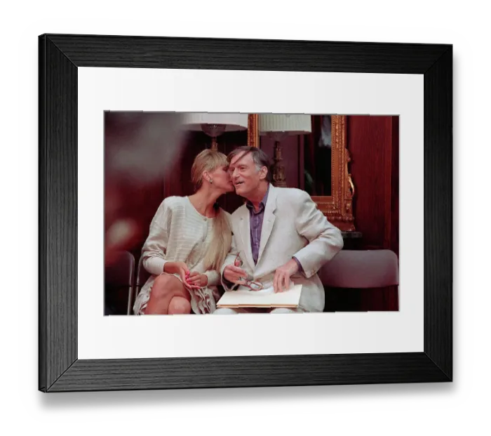 Framed Print : Hugh Hefner Gets Kiss from Girlfriend Framed Print : Hugh Hefner Gets Kiss from Girlfriend