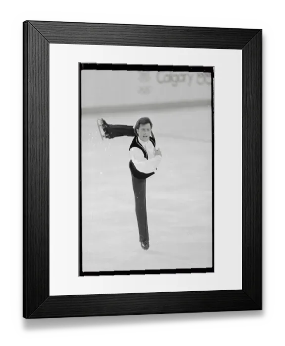 Framed Print : Brian Boitano Performing an Extended Leg Formation During Skating Program