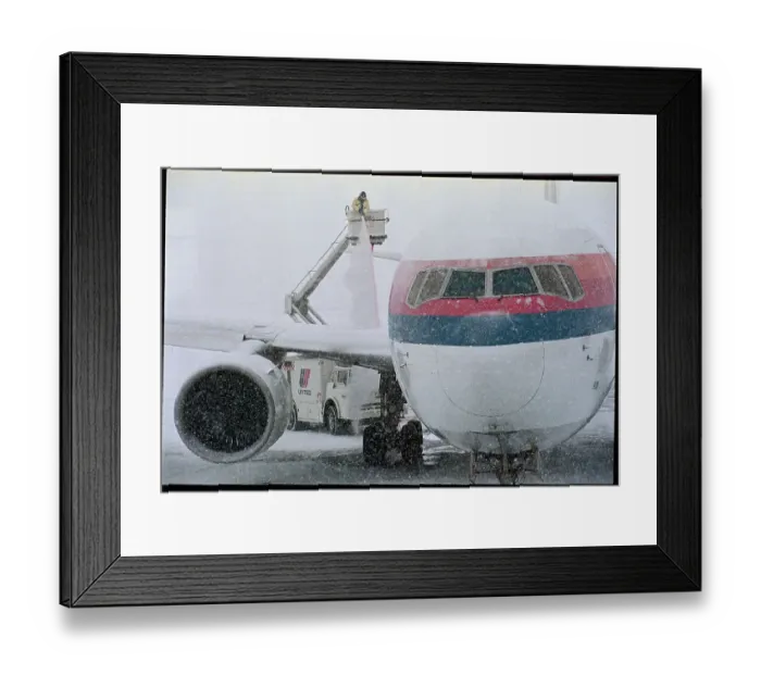 Framed Print : Airplane Being De-Iced Framed Print : Airplane Being De-Iced