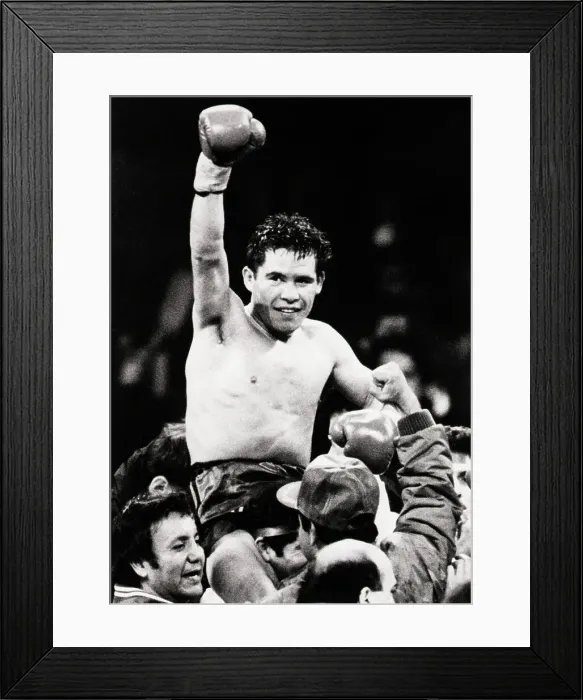 Framed Print : Julio Cesar Chavez Raises Gloved Arm