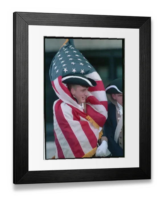 Framed Print : Young Man Wearing American Flag to Keep Warm Framed Print : Young Man Wearing American Flag to Keep Warm