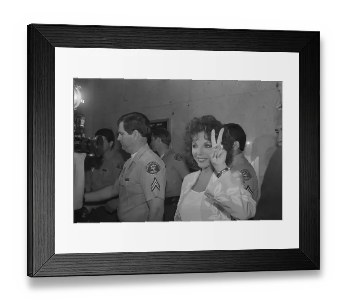 Framed Print : Actress Joan Collins Giving the Victory Sign Framed Print : Actress Joan Collins Giving the Victory Sign