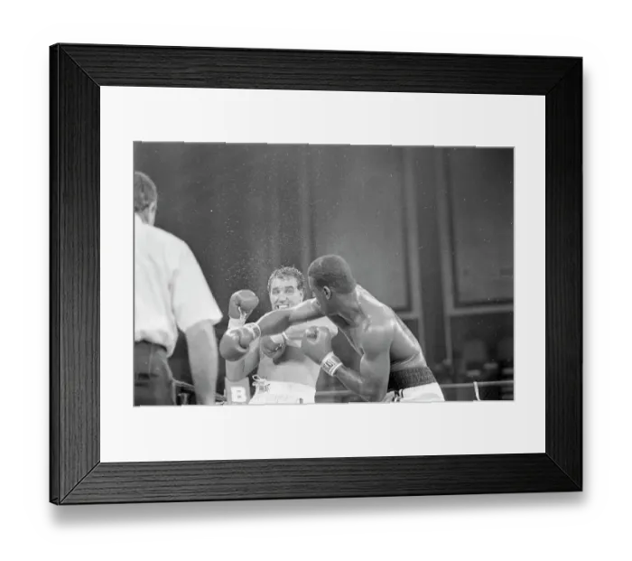 Framed Print : Michael Spinks Punches Jerry Cooney Framed Print : Michael Spinks Punches Jerry Cooney