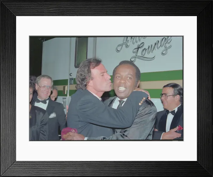 Framed Print : Julio Iglesias Kissing Lou Rawls Framed Print : Julio Iglesias Kissing Lou Rawls