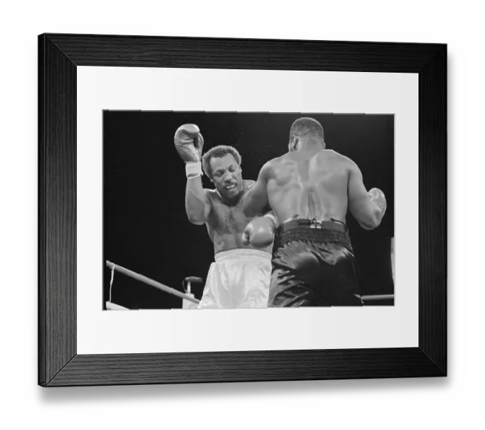 Framed Print : Mike Tyson Punches Pinklon Thomas Framed Print : Mike Tyson Punches Pinklon Thomas
