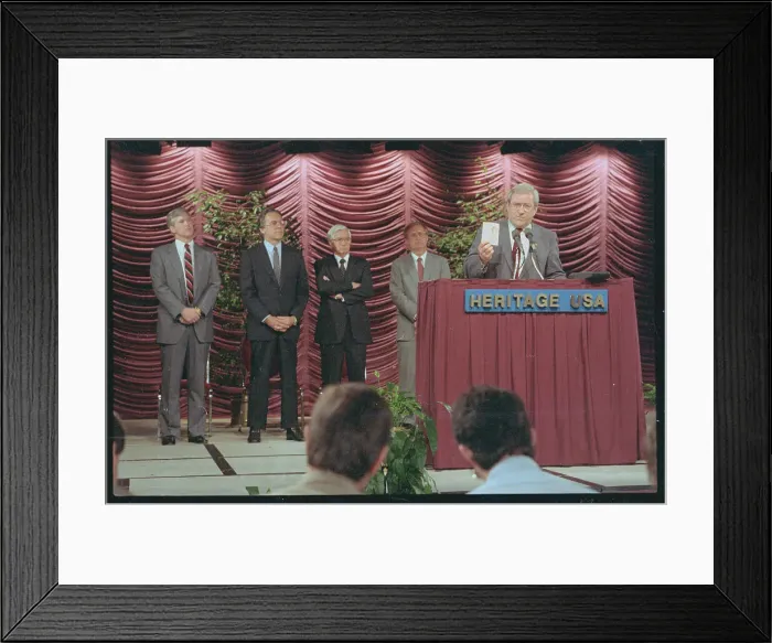 Framed Print : Jerry Falwell Showing Card at Press Conference