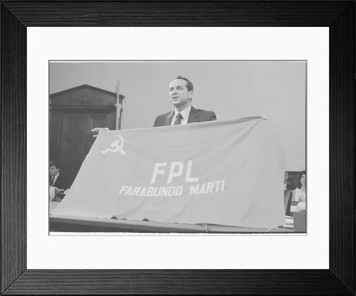 Framed Print : Felix Rodriguez Speaking at Podium with Guerilla Flag Framed Print : Felix Rodriguez Speaking at Podium with Guerilla Flag