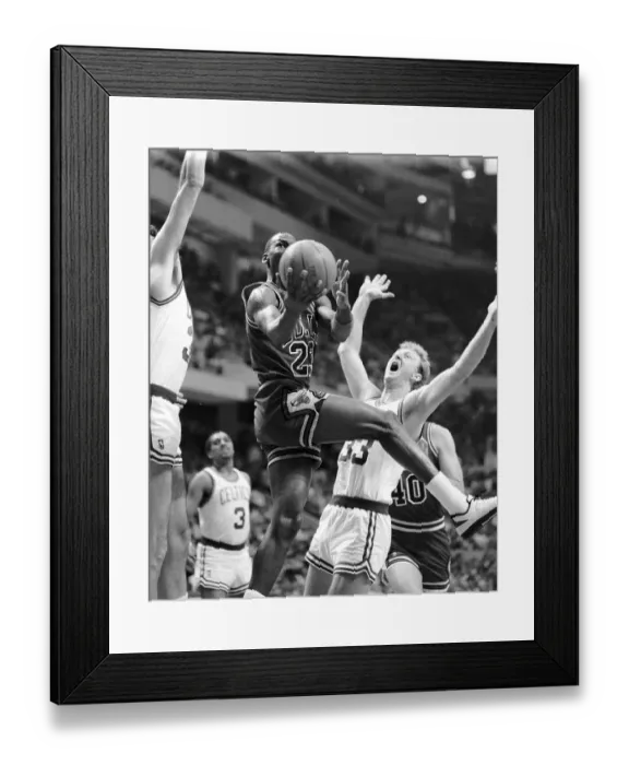 Framed Print : Michael Jordan Jumping Over Larry Bird to Score Framed Print : Michael Jordan Jumping Over Larry Bird to Score