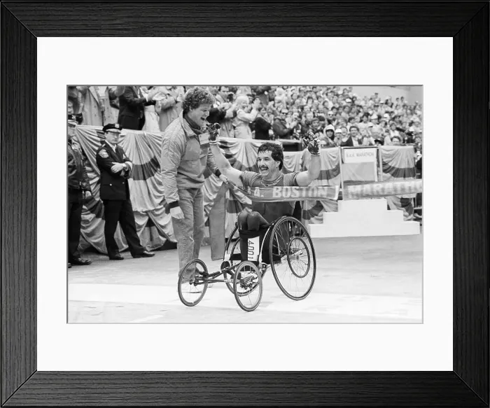 Framed Print : Man Crossing Finish Line In Wheelchair Framed Print : Man Crossing Finish Line In Wheelchair