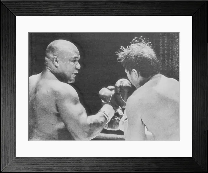 Framed Print : George Foreman Punching Opponent Framed Print : George Foreman Punching Opponent