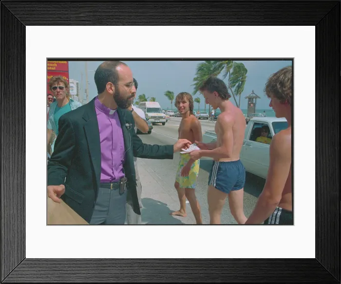 Framed Print : Reverend Passing Out Condoms Framed Print : Reverend Passing Out Condoms