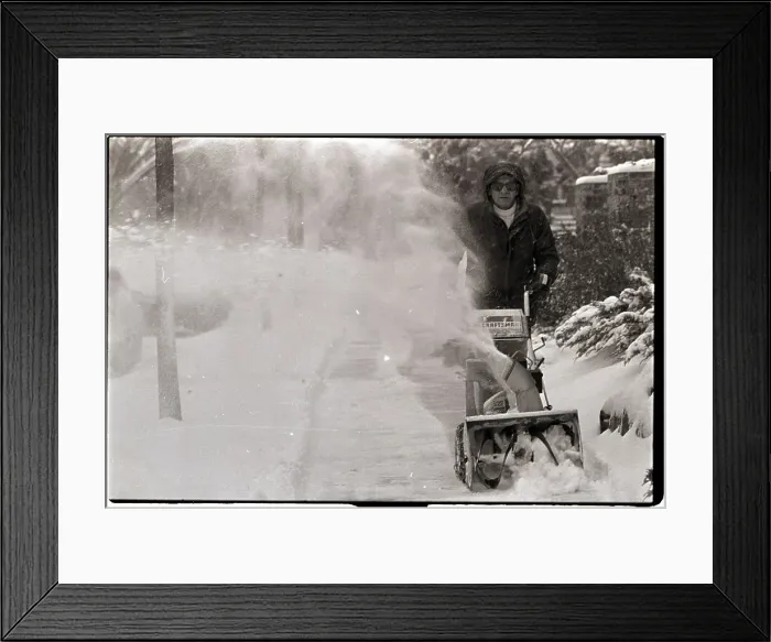 Framed Print : Man Using Snowblower to Clear Sidewalk Framed Print : Man Using Snowblower to Clear Sidewalk