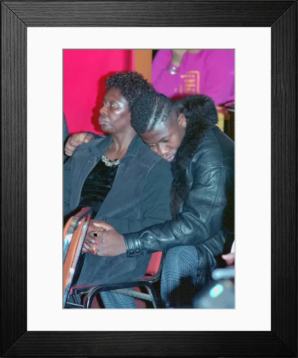 Framed Print : Anthony Griffith Consoling His Mother Framed Print : Anthony Griffith Consoling His Mother