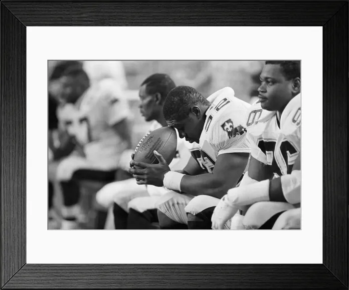 Framed Print : Linebacker Deep in Thought on Sidelines Framed Print : Linebacker Deep in Thought on Sidelines
