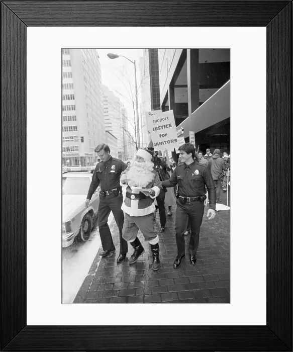 Framed Print : Police Arresting Santa Claus Framed Print : Police Arresting Santa Claus