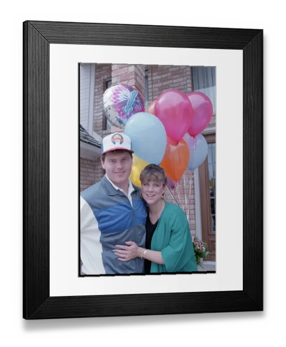 Framed Print : Debbie and Roger Clemens Hug with Balloons Framed Print : Debbie and Roger Clemens Hug with Balloons