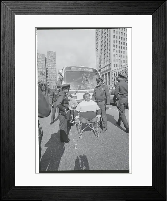 Framed Print : Policeman Arresting Disabled Man Framed Print : Policeman Arresting Disabled Man