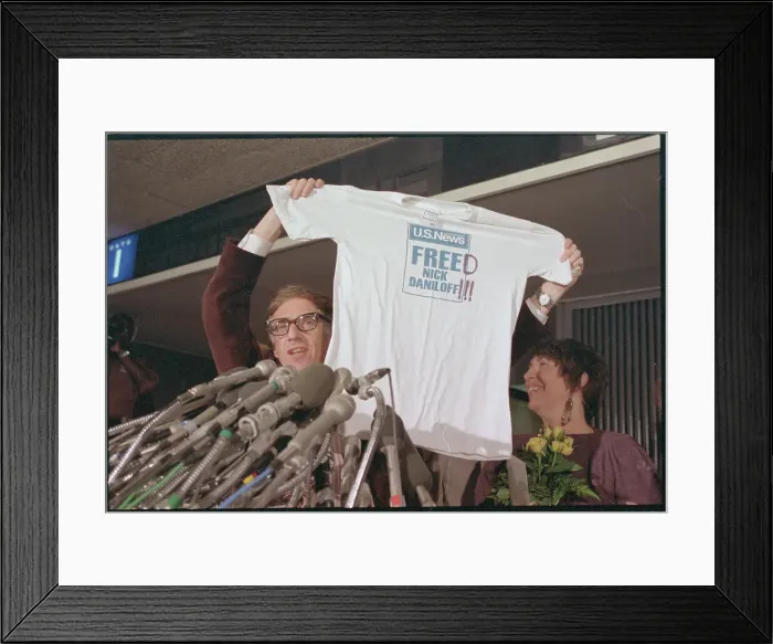 Framed Print : Nicholas Daniloff and Wife Displaying T-shirt Framed Print : Nicholas Daniloff and Wife Displaying T-shirt
