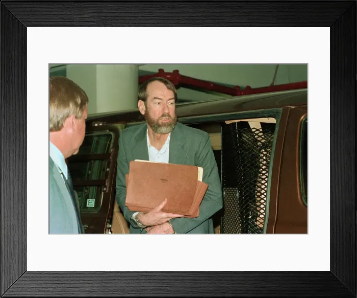 Framed Print : Jerry Whitworth Holding Documents Framed Print : Jerry Whitworth Holding Documents