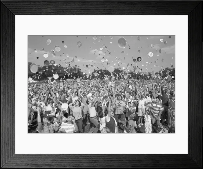 Framed Print : Crowd Throwing Frisbees into the Air Framed Print : Crowd Throwing Frisbees into the Air