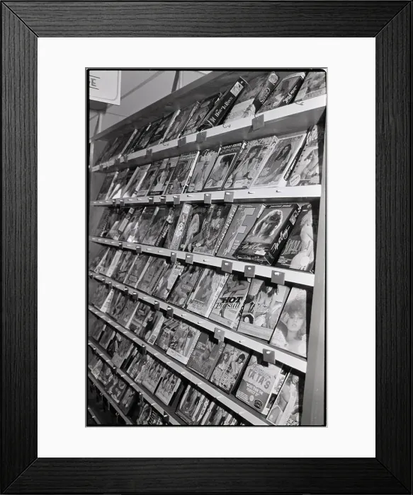 Framed Print : Adult Video Tapes On Shelf In Store Framed Print : Adult Video Tapes On Shelf In Store