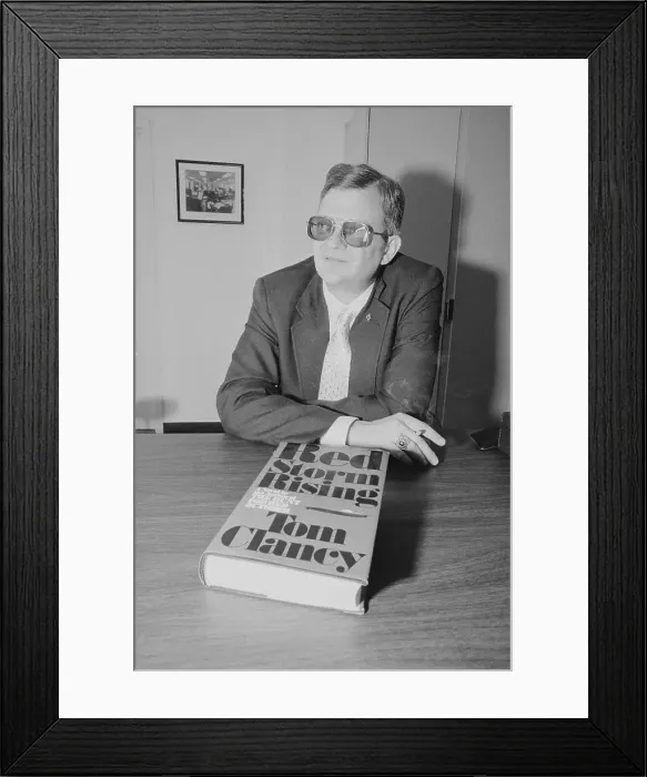 Framed Print : Tom Clancy with His Book Red Storm Rising Framed Print : Tom Clancy with His Book Red Storm Rising