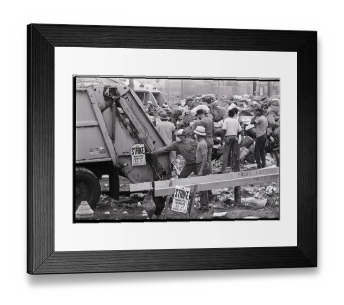 Framed Print : Man Hangs Strike Sign on Garbage Truck Framed Print : Man Hangs Strike Sign on Garbage Truck