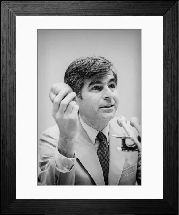 Framed Print : Mike Dukakis Holding Apple to Make His Point at Meeting Framed Print : Mike Dukakis Holding Apple to Make His Point at Meeting