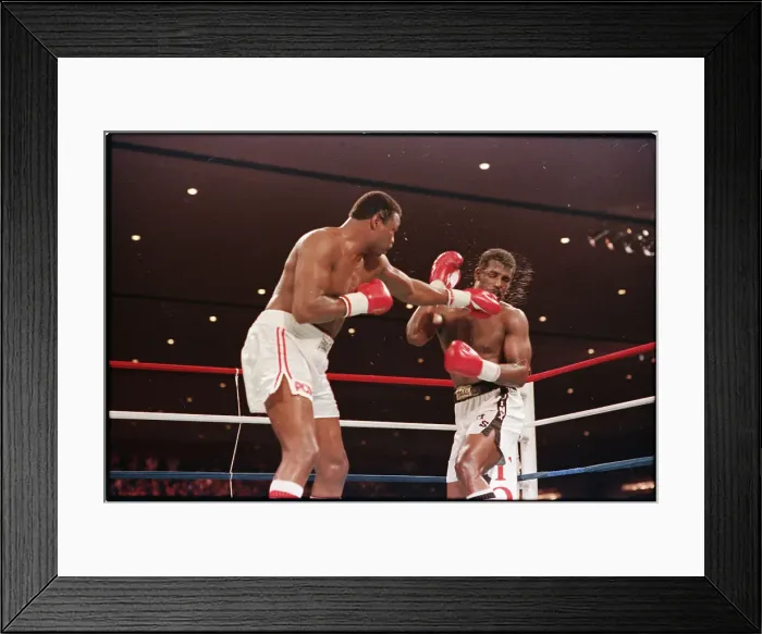 Framed Print : Larry Holmes Punching Michael Spinks Framed Print : Larry Holmes Punching Michael Spinks