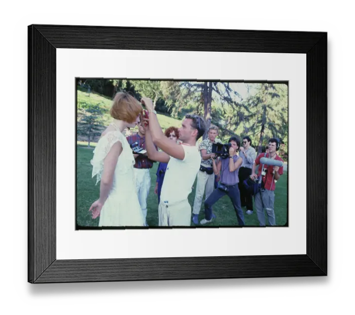 Framed Print : Makeup Artist Adjusting Model's Hair on Outdoor Shoot Framed Print : Makeup Artist Adjusting Model's Hair on Outdoor Shoot