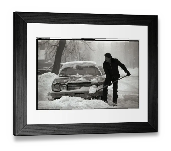 Framed Print : Man Shoveling out Car Framed Print : Man Shoveling out Car