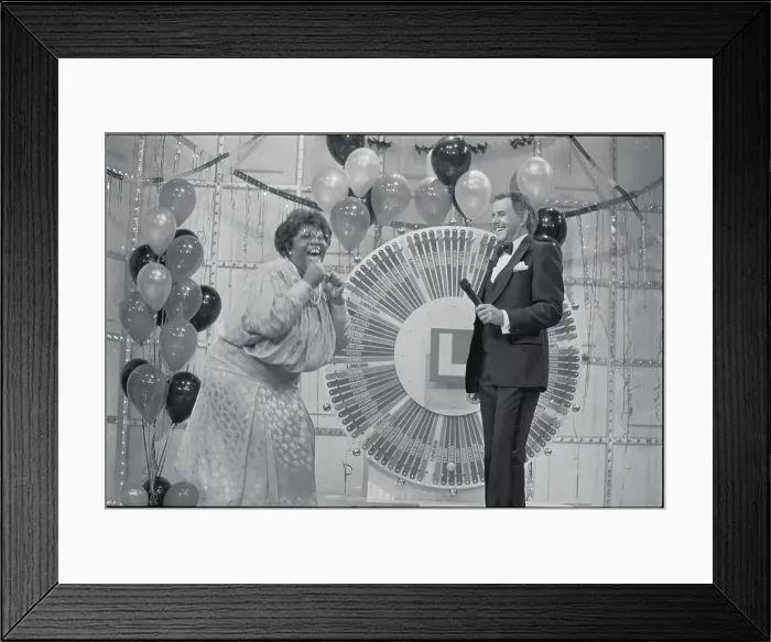 Framed Print : Woman Celebrating at Lottery Wheel Framed Print : Woman Celebrating at Lottery Wheel