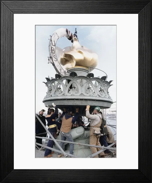 Framed Print : City Workers Mounting the Statue of Liberty Torch