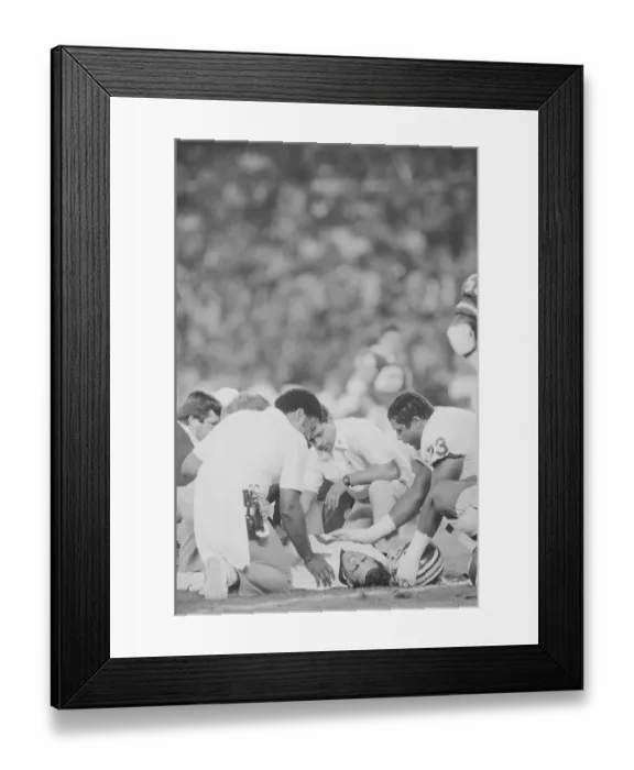 Framed Print : Athletic Trainers Surrounding Joe Theismann on Field Framed Print : Athletic Trainers Surrounding Joe Theismann on Field