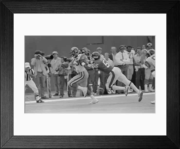 Framed Print : Lawrence Taylor Being Stopped by Eric Dickerson in Football Play Framed Print : Lawrence Taylor Being Stopped by Eric Dickerson in Football Play