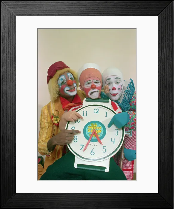 Framed Print : Clowns Holding a Clock Framed Print : Clowns Holding a Clock