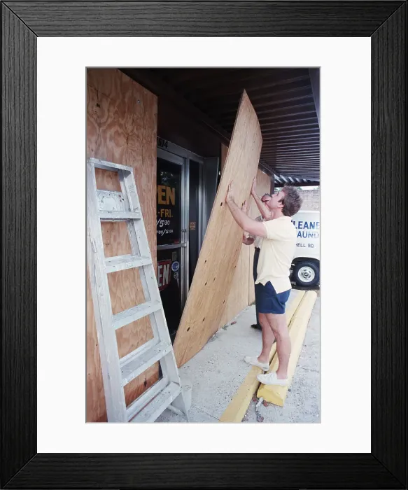 Framed Print : Leland Waiet and Dad Put Boards On Door Framed Print : Leland Waiet and Dad Put Boards On Door
