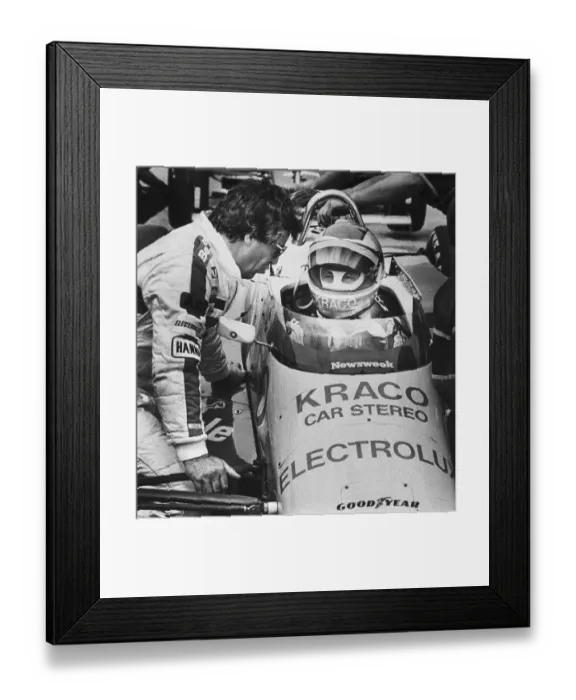 Framed Print : Mario Andretti Talking with his Son in Race Car Framed Print : Mario Andretti Talking with his Son in Race Car