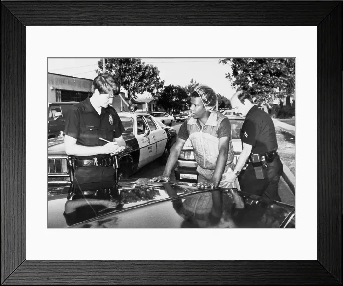 Framed Print : Police Checking out Gang Member for Concealed Items Framed Print : Police Checking out Gang Member for Concealed Items
