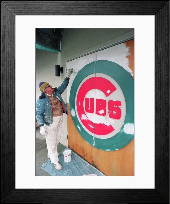 Framed Print : Andres Hernandez Applying Paint Onto Logo Framed Print : Andres Hernandez Applying Paint Onto Logo