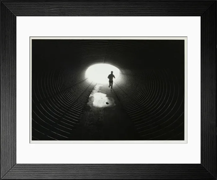 Framed Print : Jogger Entering Darkened Tunnel Framed Print : Jogger Entering Darkened Tunnel