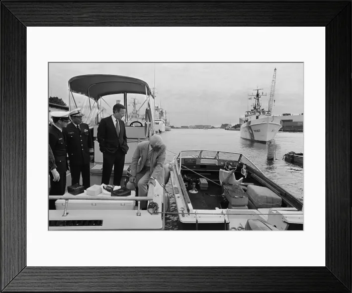 Framed Print : George Bush Inspecting Confiscated Items from a Boat