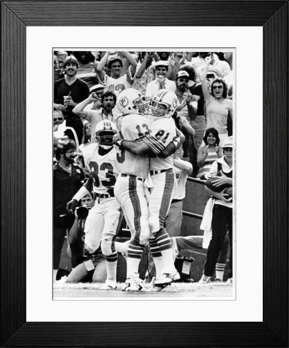 Framed Print : Dan Marino Hugs Teammate Jimmy Cefalo