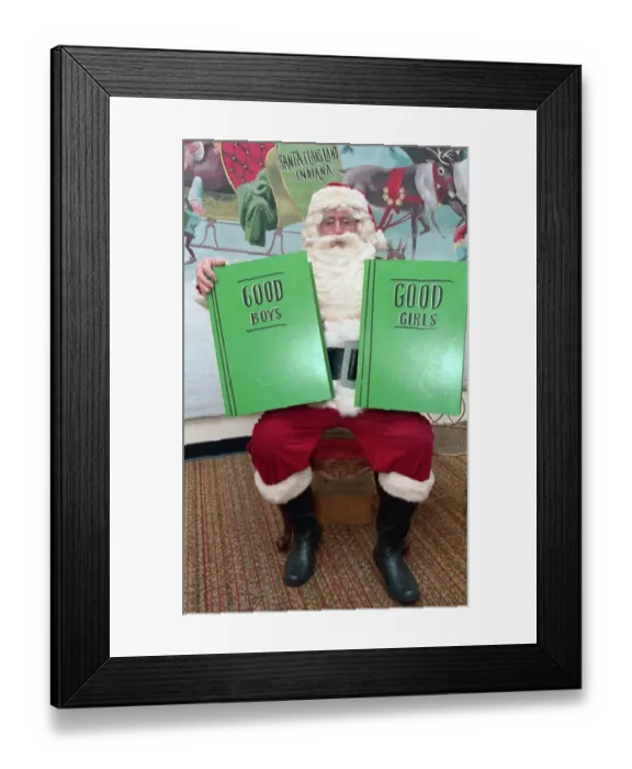Framed Print : Man Dressed as Santa Claus Holding Books Framed Print : Man Dressed as Santa Claus Holding Books