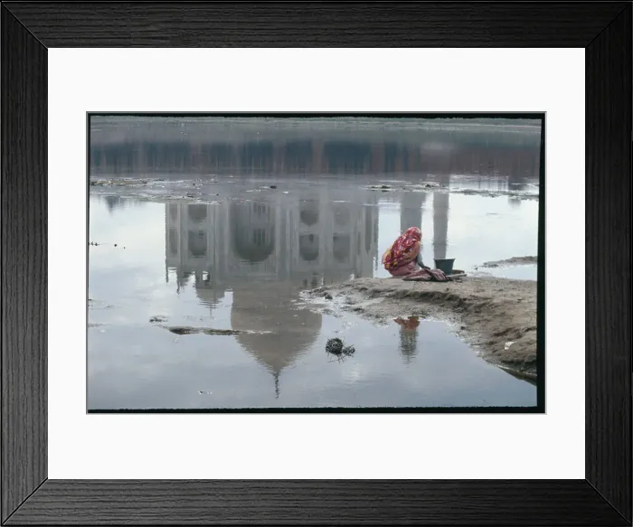 Framed Print : Woman Kneeling at Water's Edge near Taj Mahal Framed Print : Woman Kneeling at Water's Edge near Taj Mahal