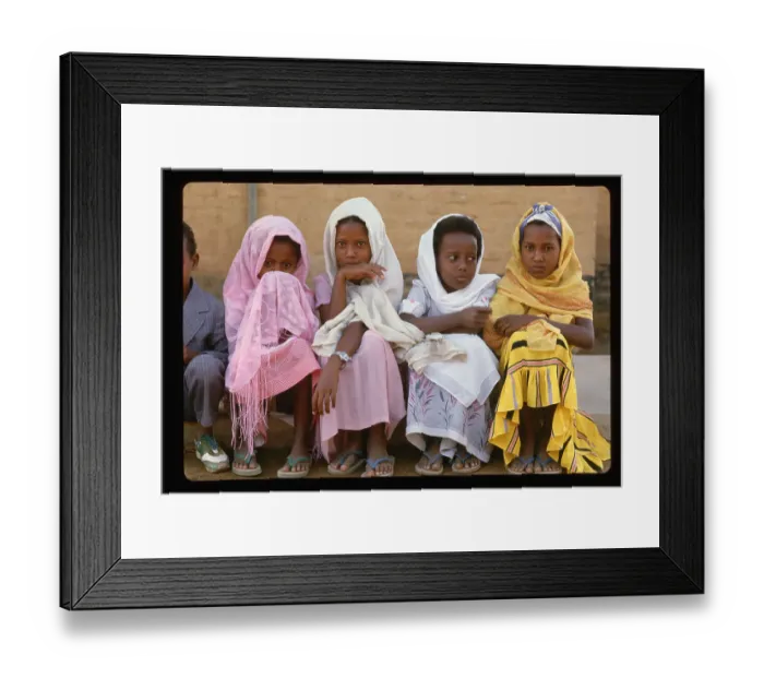 Framed Print : Young Sudanese Girls Sit at Curb Framed Print : Young Sudanese Girls Sit at Curb